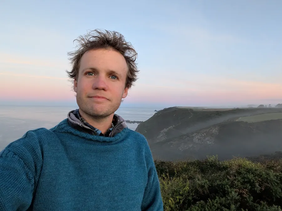 Ross Torode on the clifftop above Guernsey’s south coast at dawn